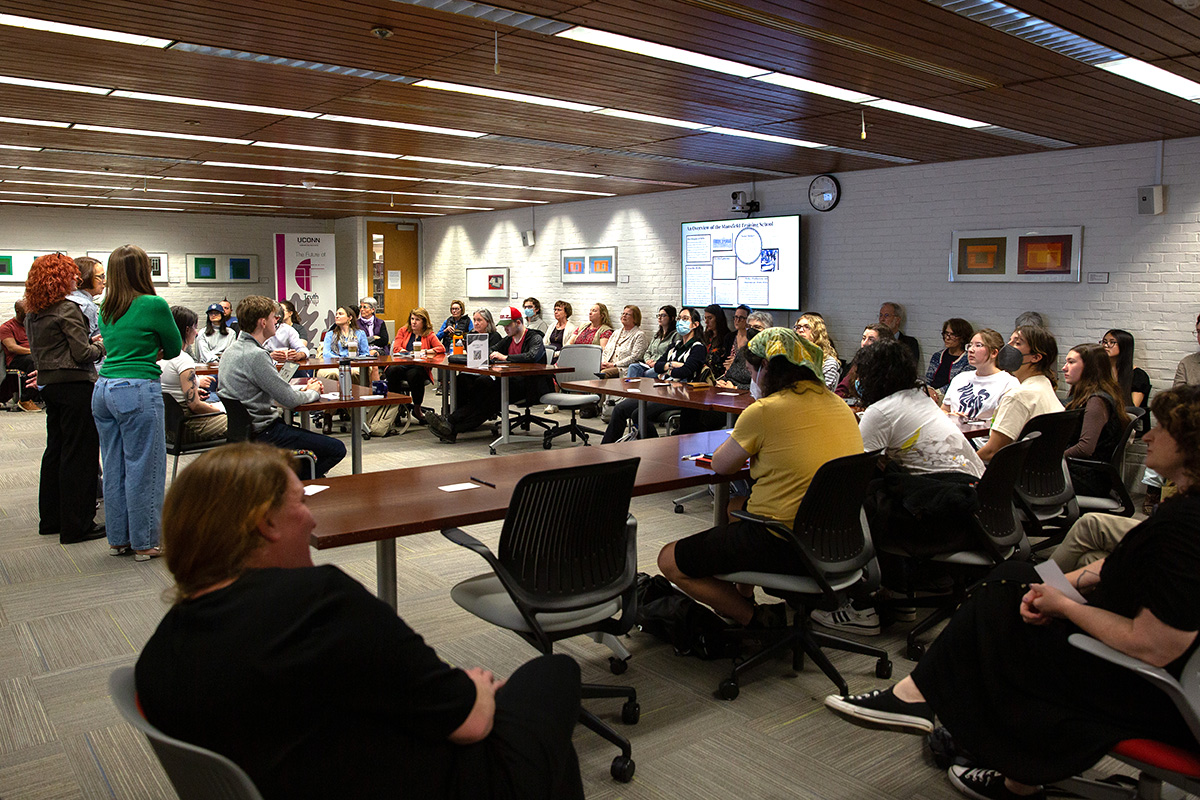 Students present their at an event hosted by the Humanities Institute.