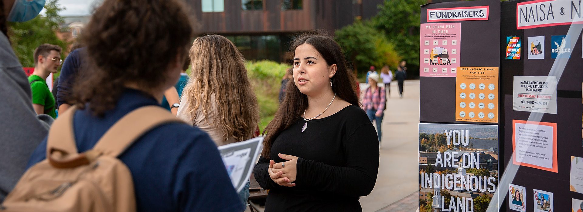 A student tables for Native American Cultural Programs at the UConn involvement fair.